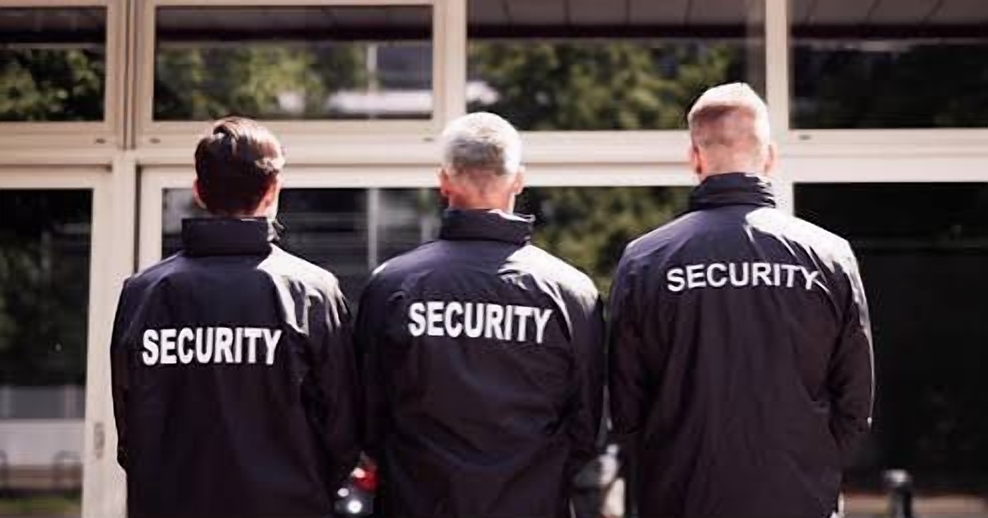 Security officers standing outside a building