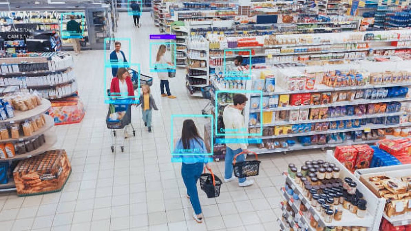 Shoppers in a busy supermarket with CCTV monitoring